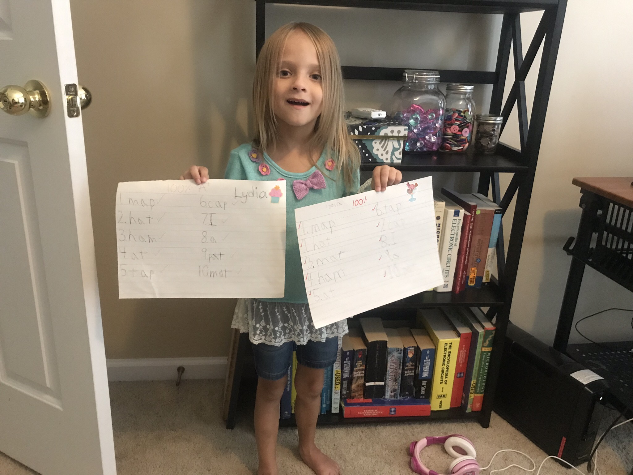 6-year-old-holding-spelling-test-results