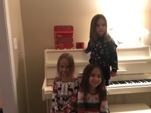 Kids standing next to Santa's mailbox